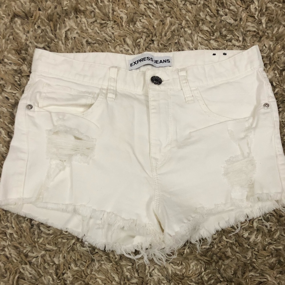 Mid rise distressed white shorts